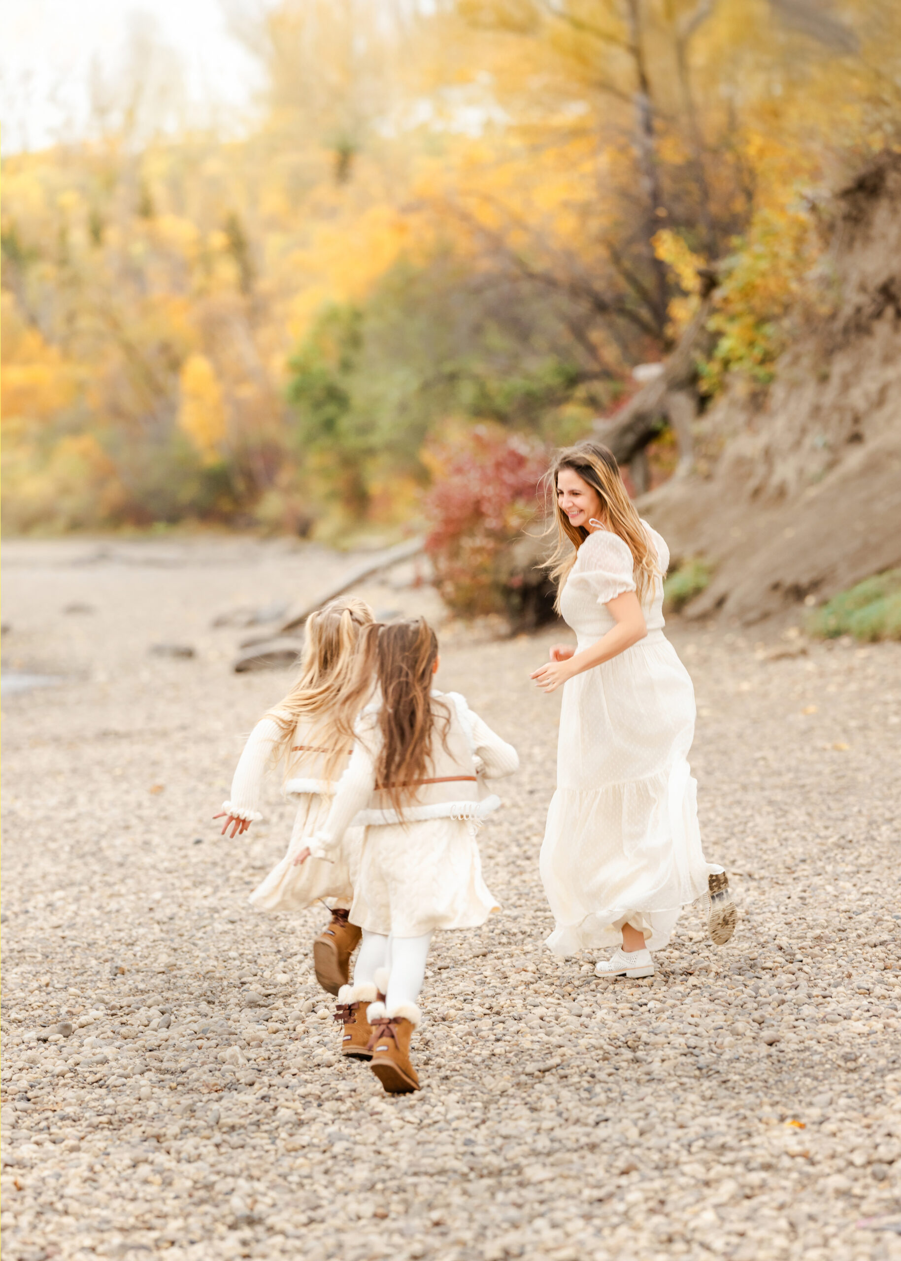Soft, emotional family portrait showing close connection and tender smiles in Edmonton.