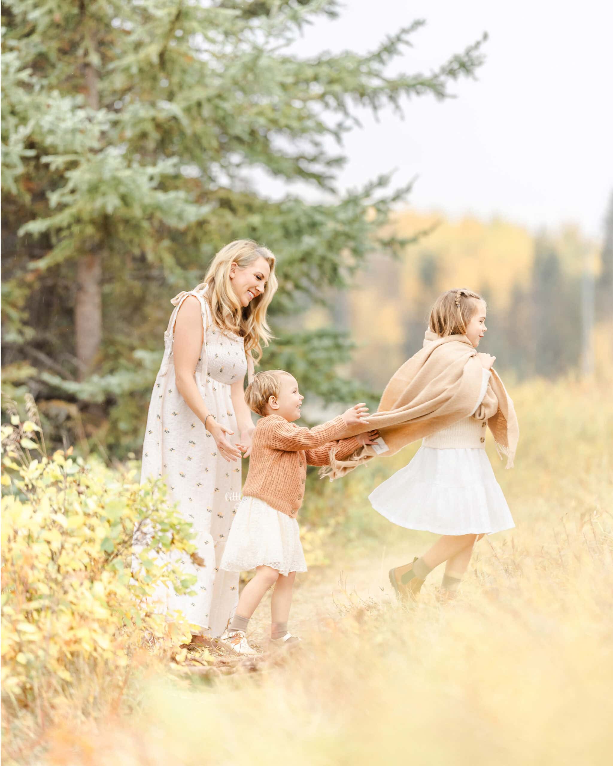 mom with her 2 daughters in Edmonton park for family photography