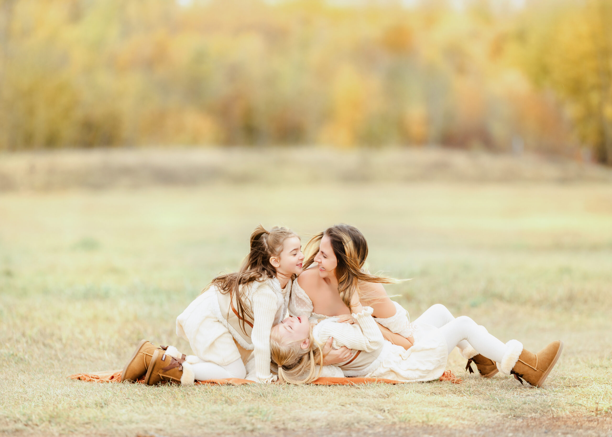 Mother cuddling her baby during a light and airy family photoshoot in Edmonton.