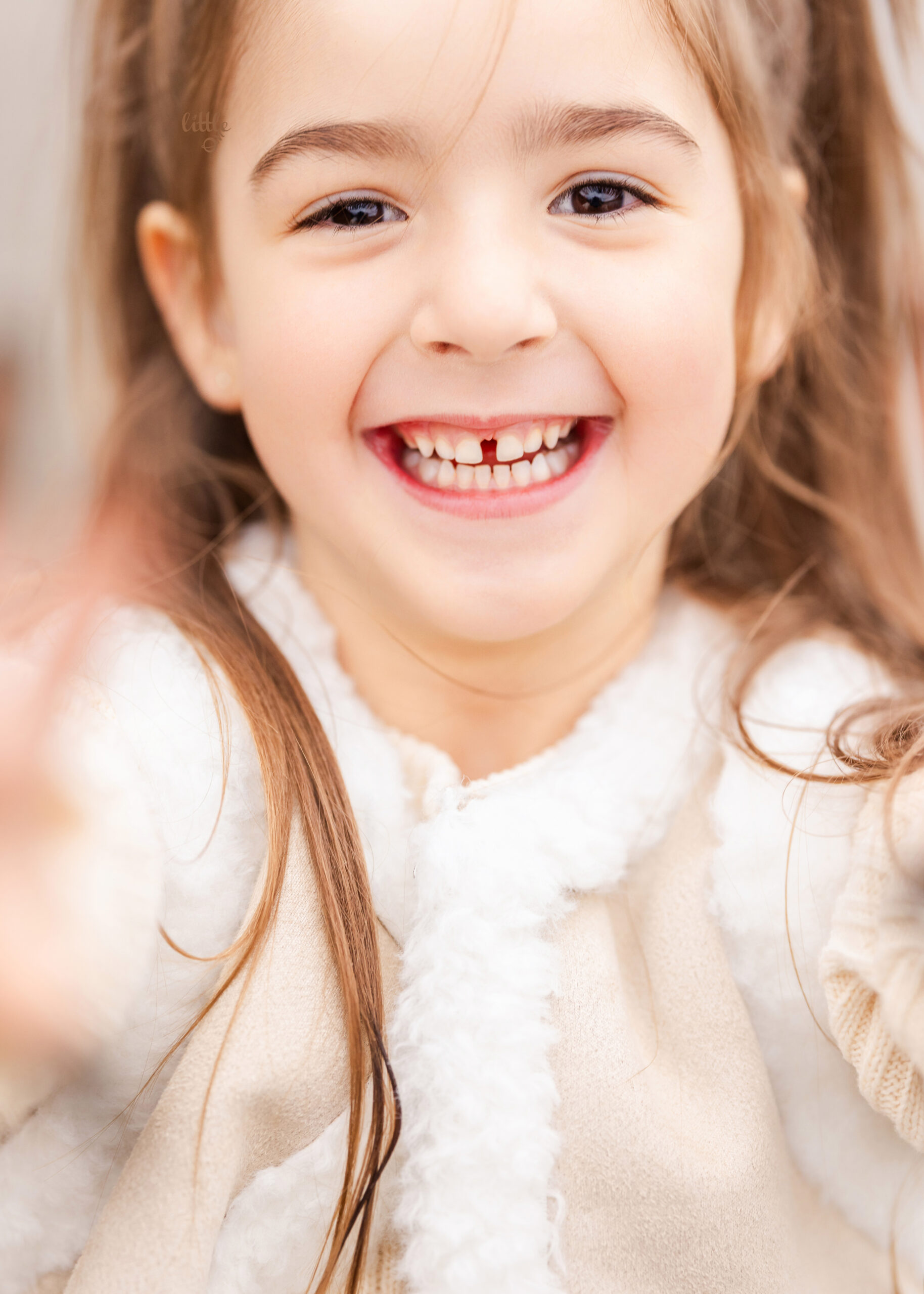 Candid outdoor family portrait capturing warm moments between parents and children in Edmonton.
