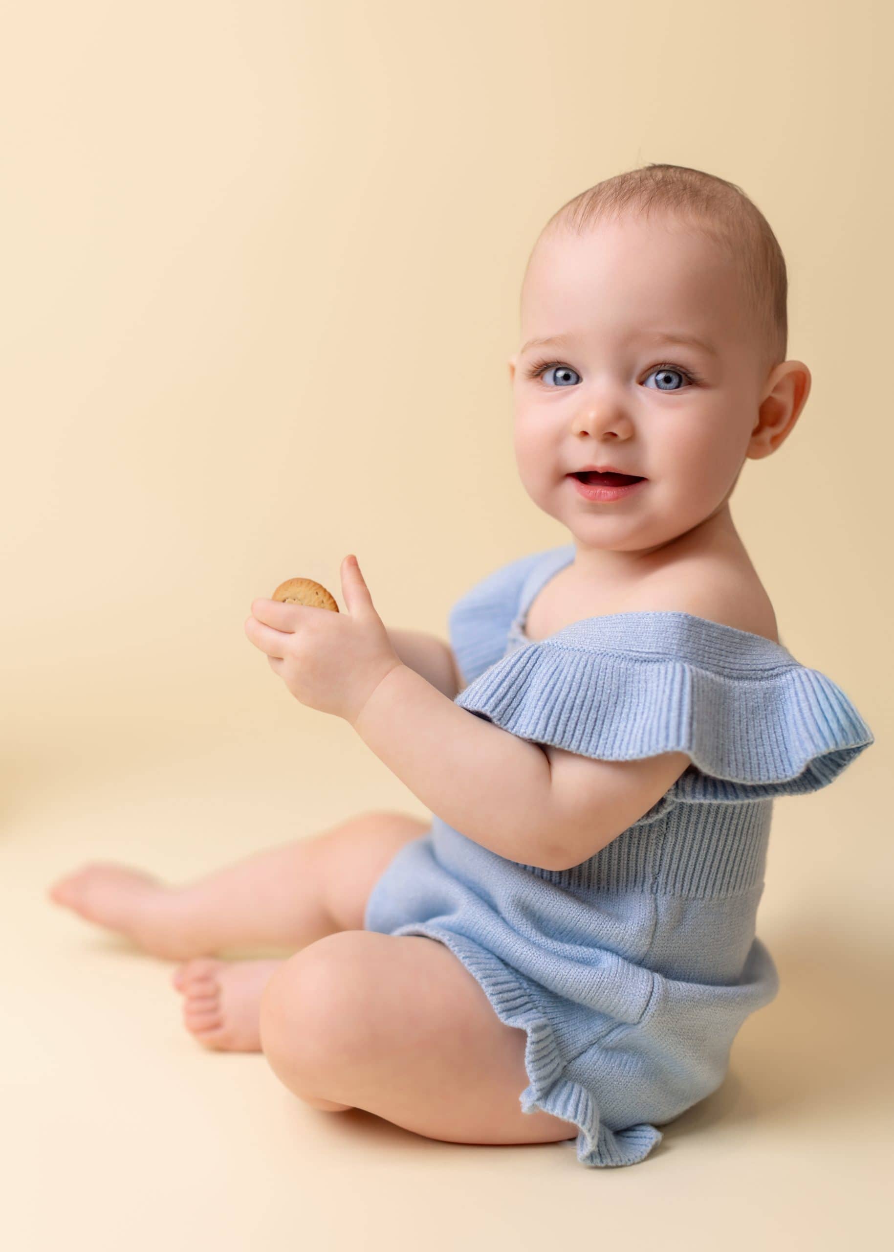 baby taking photos for her 12 months milestone photo