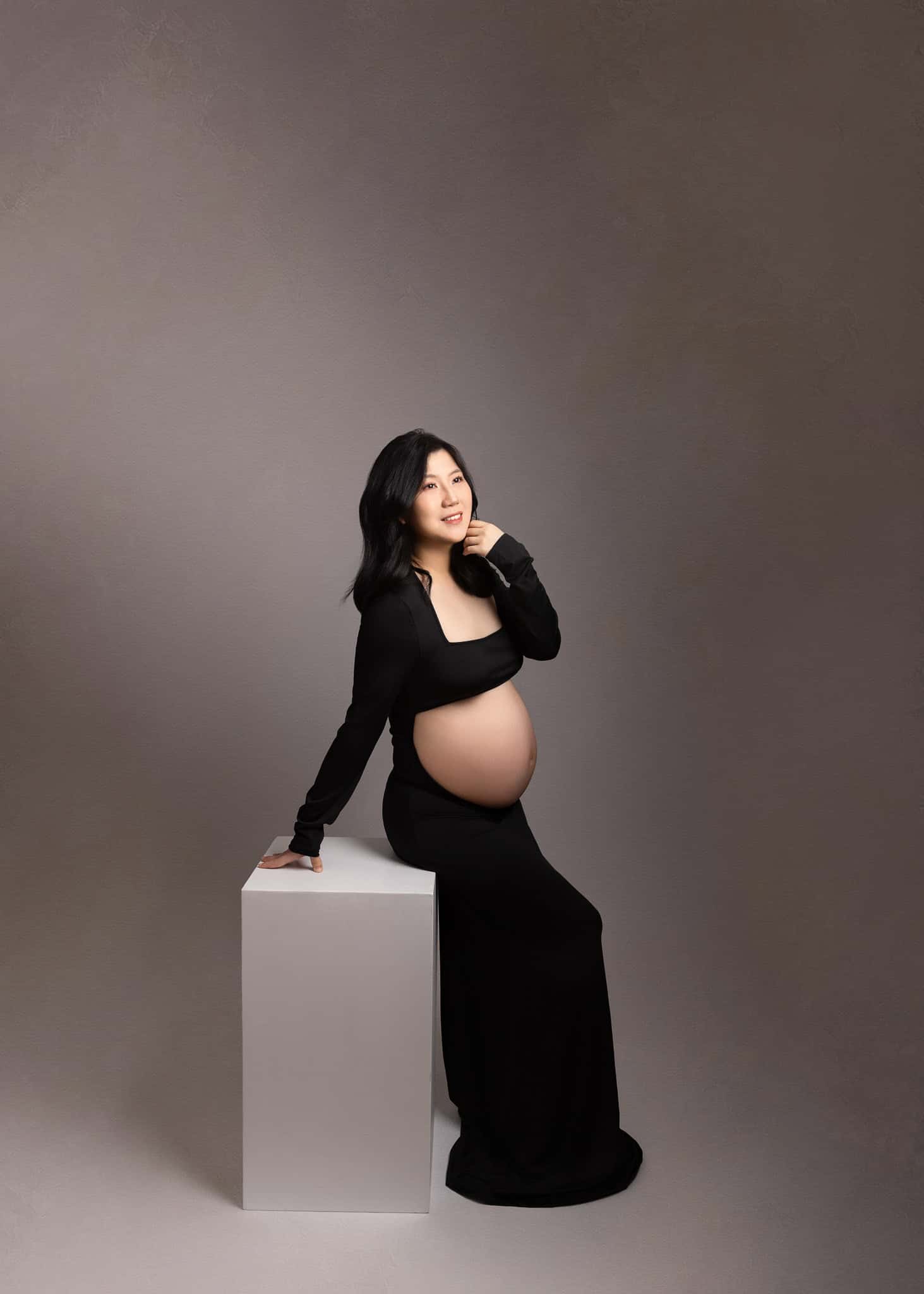 Elegant studio maternity photoshoot in Edmonton with black dress