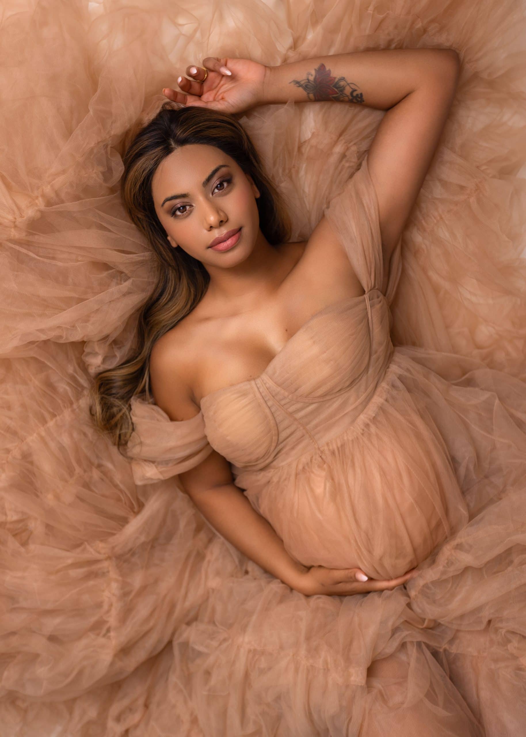 Mom-to-be embracing her bump – Edmonton maternity photographer captures emotional moment